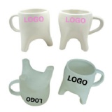 Tooth shape, white ceramic drinking mug.